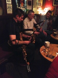 Jonathan Kennedy playing uilleann pipes with an Irish man he has played pipes with the States.